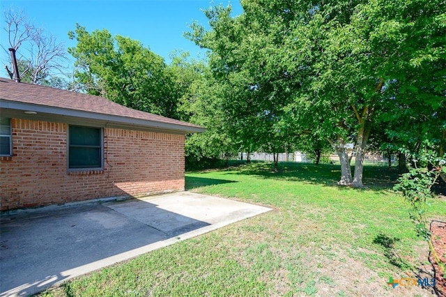 1504 Phyllis Dr, Copperas Cove, TX 76522 - view of grassy yard featuring a patio area