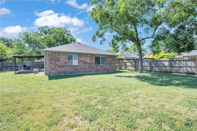 exterior space with a lawn, central AC, and a patio area