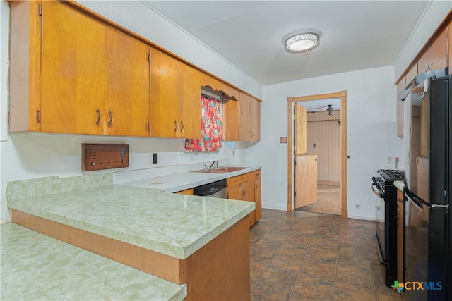 kitchen featuring kitchen peninsula, appliances with stainless steel finishes, and sink