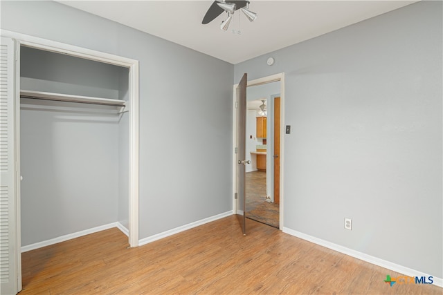 unfurnished bedroom featuring a closet, ceiling fan, and light hardwood / wood-style flooring