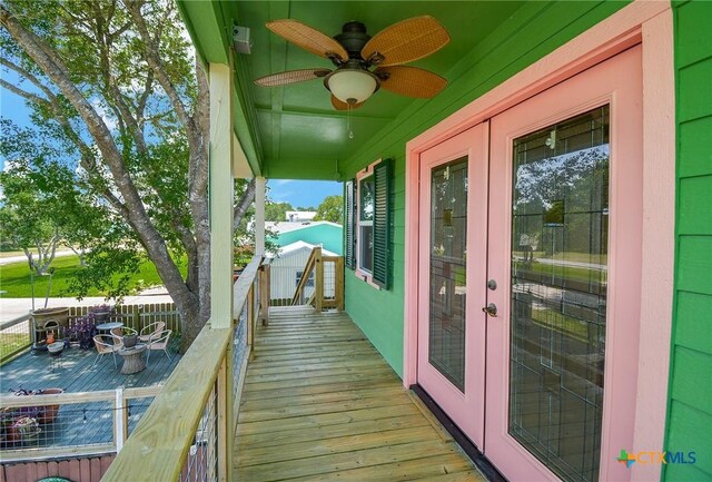 balcony featuring french doors and ceiling fan