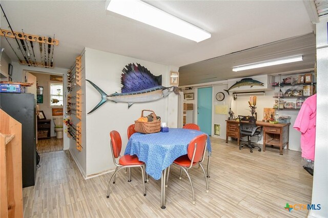 dining room featuring light wood-type flooring