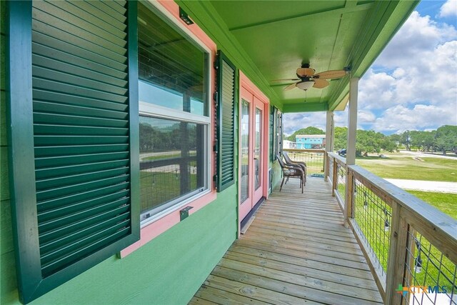 deck featuring ceiling fan and covered porch