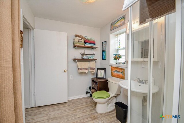 bathroom featuring sink and toilet