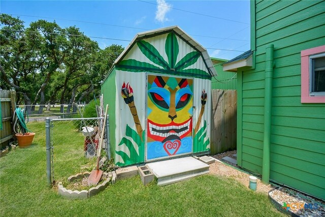 view of outbuilding featuring a lawn