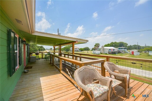 deck featuring covered porch