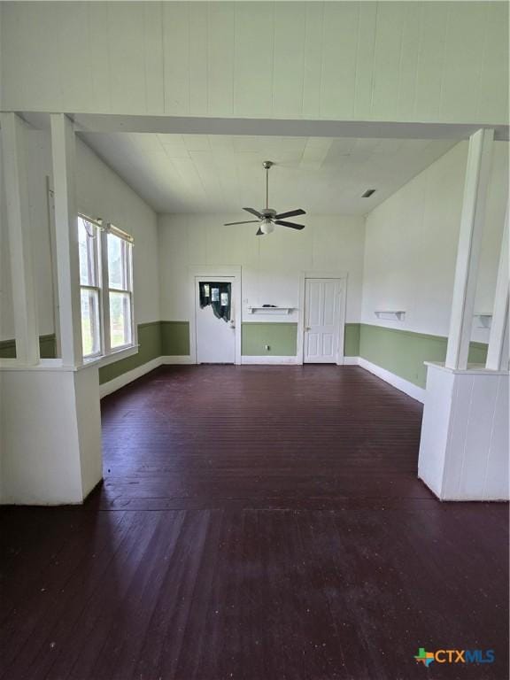 206 Dallas St, Yoakum, TX 77995 - unfurnished living room with hardwood / wood-style flooring and a ceiling fan