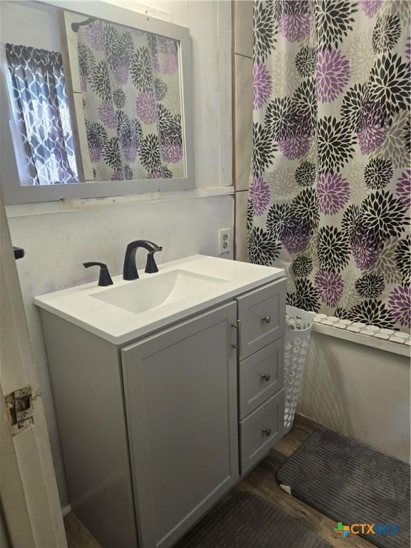 bathroom featuring vanity and wood finished floors