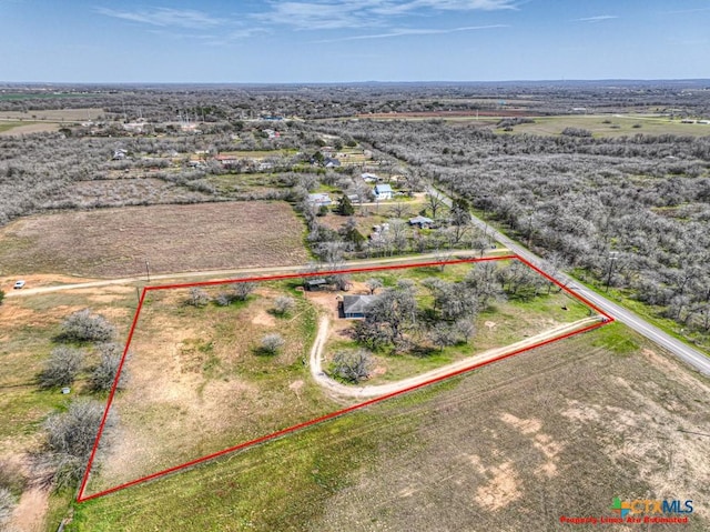 birds eye view of property featuring a rural view