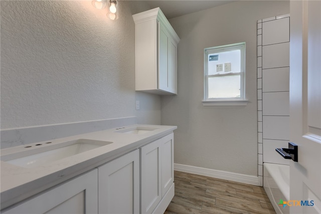 bathroom featuring hardwood / wood-style flooring and vanity