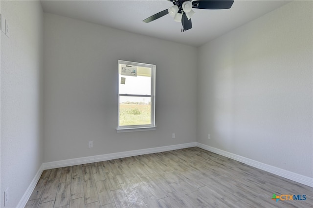 unfurnished room featuring light hardwood / wood-style floors and ceiling fan