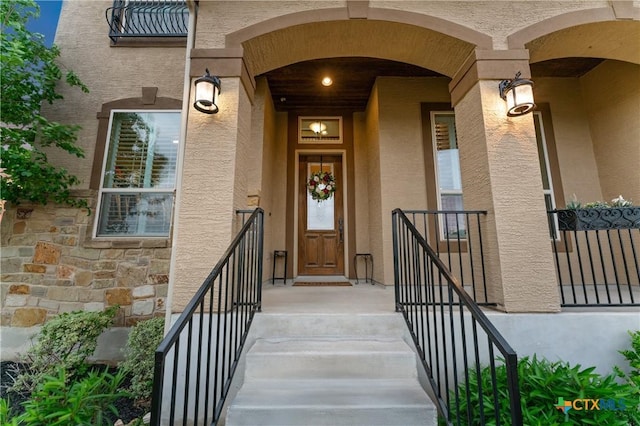 doorway to property with stucco siding