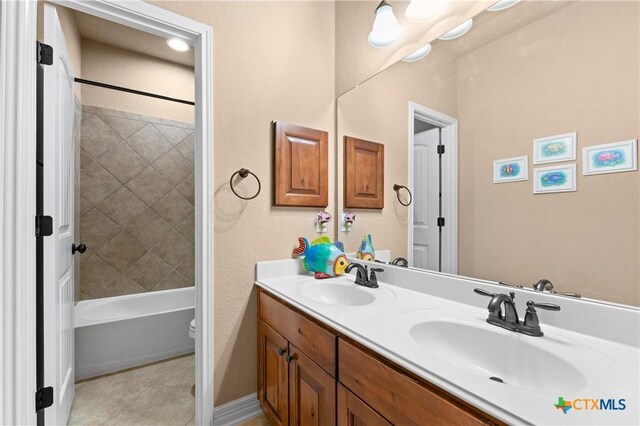 full bathroom with double vanity, shower / washtub combination, toilet, and a sink
