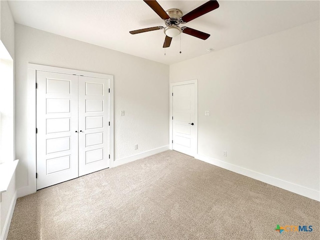 1637 Bob White Dr, Spring Branch, TX 78070 - unfurnished bedroom with carpet floors, baseboards, a closet, and ceiling fan