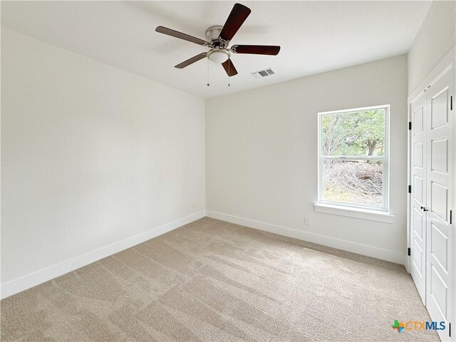 1637 Bob White Dr, Spring Branch, TX 78070 - empty room with light carpet, baseboards, and a ceiling fan
