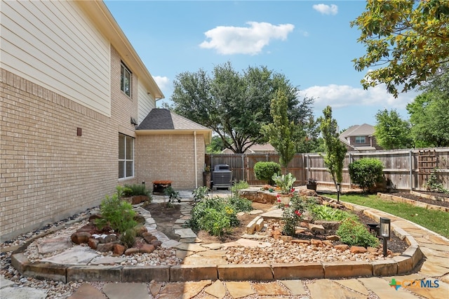 19303 Anna Kate Ct, Pflugerville, TX 78660 - fenced backyard with a patio and a garden