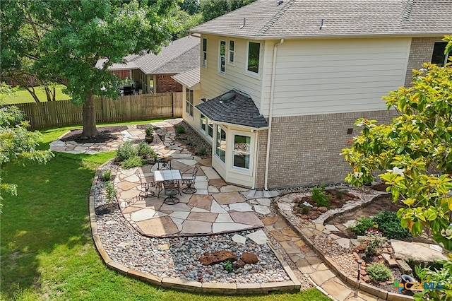 19303 Anna Kate Ct, Pflugerville, TX 78660 - back of house with brick siding, a shingled roof, and a patio