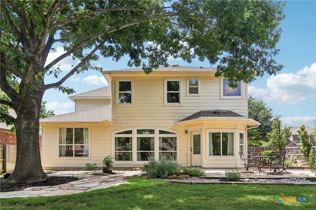 19303 Anna Kate Ct, Pflugerville, TX 78660 - rear view of property with a patio and roof with shingles