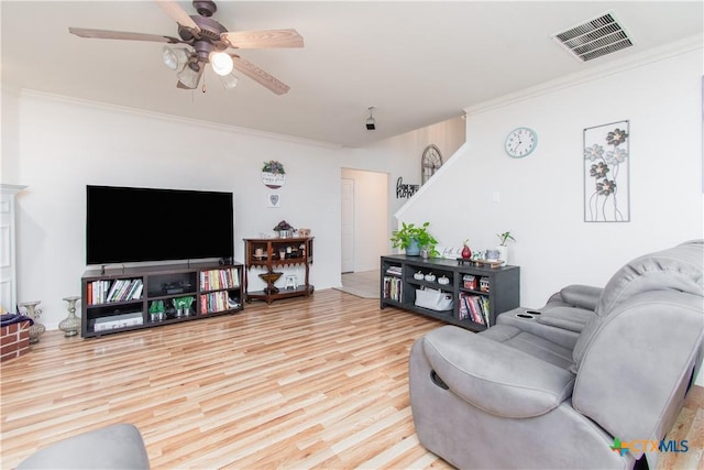 2409 Eppinette Dr, Killeen, TX 76542 - living room featuring wood finished floors, ornamental molding, and ceiling fan