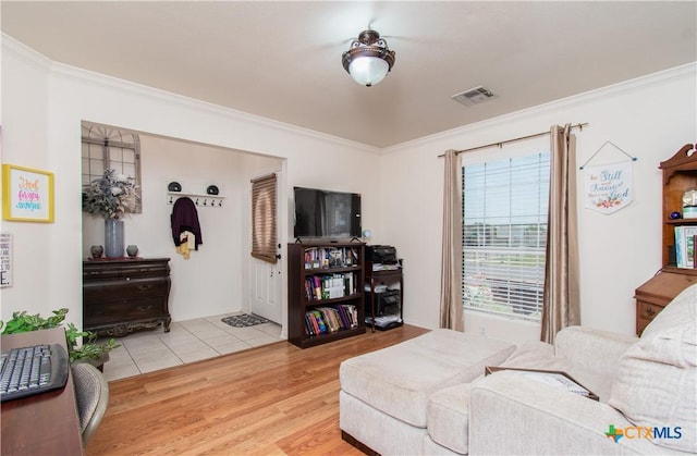 2409 Eppinette Dr, Killeen, TX 76542 - living area featuring ornamental molding and wood finished floors