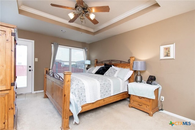 2409 Eppinette Dr, Killeen, TX 76542 - bedroom with a raised ceiling, light colored carpet, ornamental molding, baseboards, and a ceiling fan