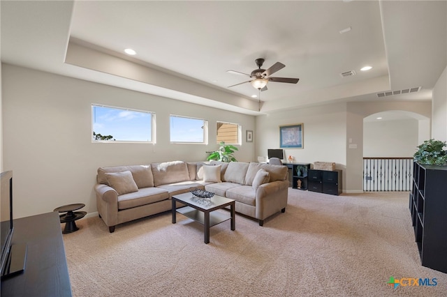 182 Emma Loop, Austin, TX 78737 - living area featuring a tray ceiling, ceiling fan, recessed lighting, light carpet, and baseboards