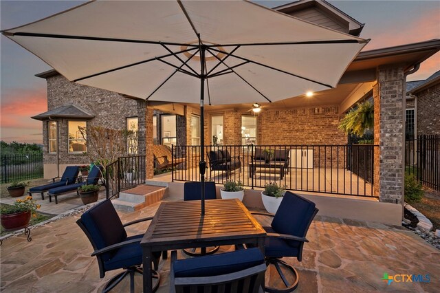 182 Emma Loop, Austin, TX 78737 - view of patio / terrace with fence and outdoor dining space