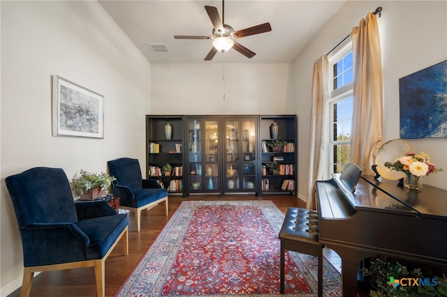 182 Emma Loop, Austin, TX 78737 - living area featuring ceiling fan, wood finished floors, and baseboards