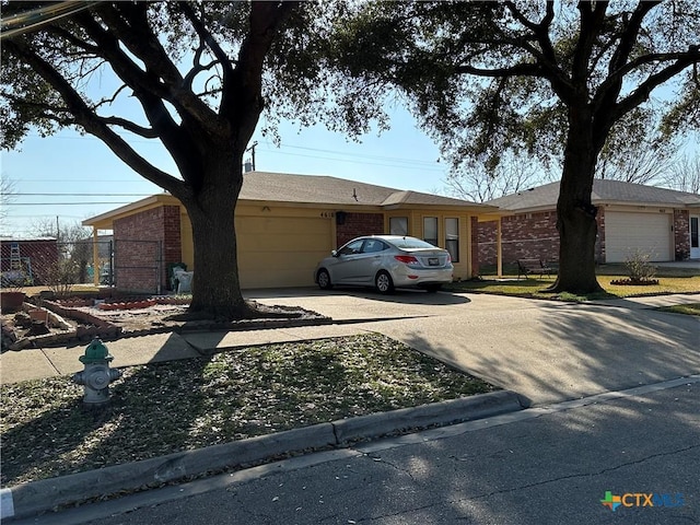 single story home with a garage