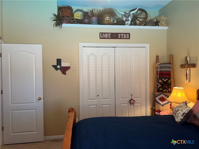 bedroom featuring a closet and carpet