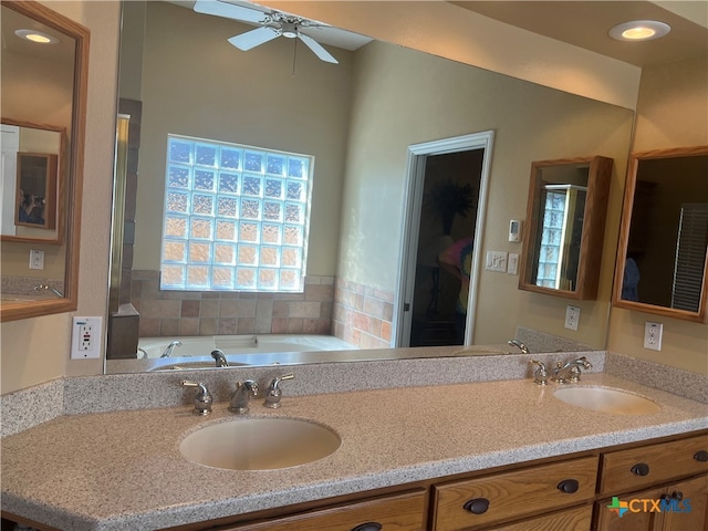 bathroom with ceiling fan and vanity