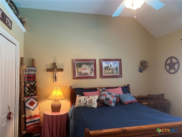 bedroom with ceiling fan, vaulted ceiling, and a closet