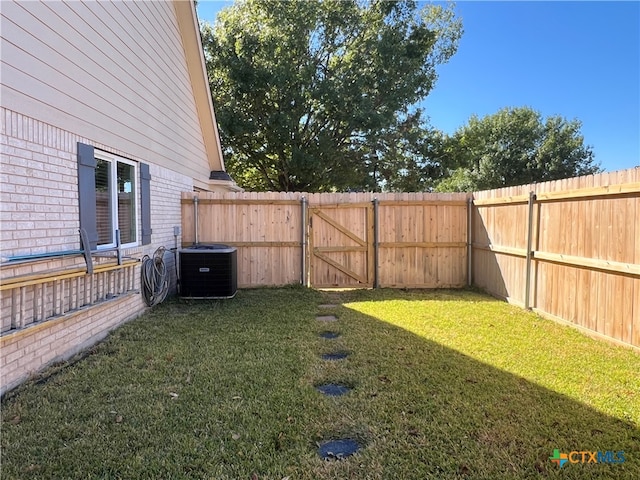 view of yard featuring central AC