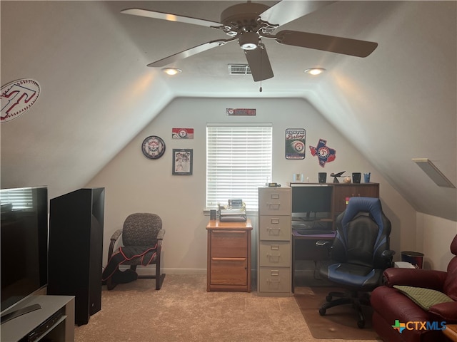 carpeted office with lofted ceiling and ceiling fan