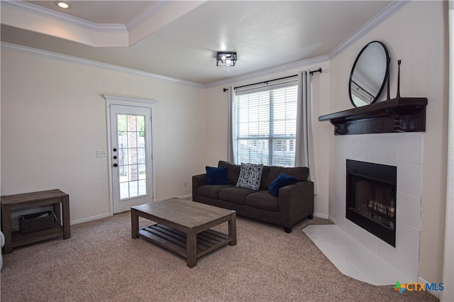 living room with ornamental molding, a wealth of natural light, and light carpet