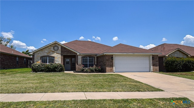 single story home with a garage and a front yard