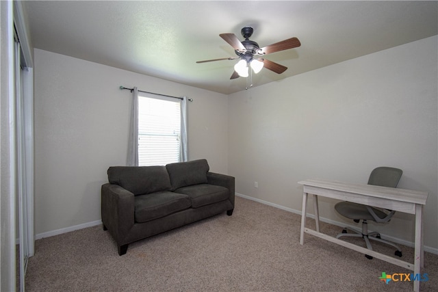 carpeted office with ceiling fan