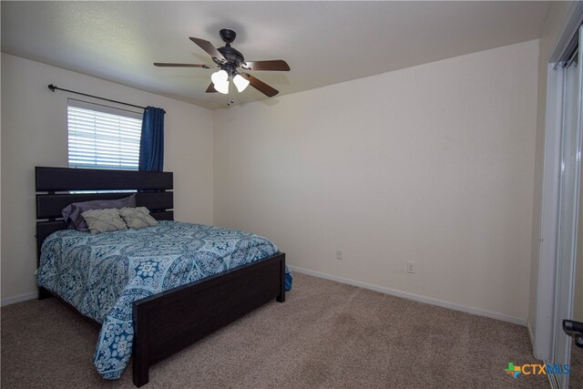 carpeted bedroom featuring ceiling fan