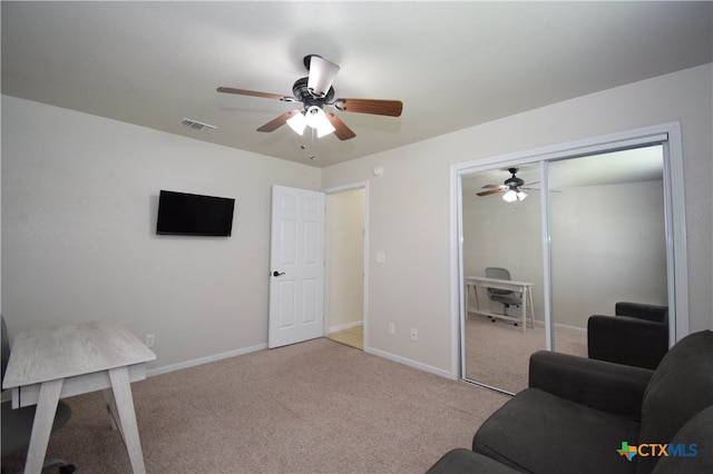 interior space featuring ceiling fan