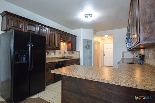 kitchen with black appliances, light tile patterned flooring, backsplash, dark brown cabinetry, and sink