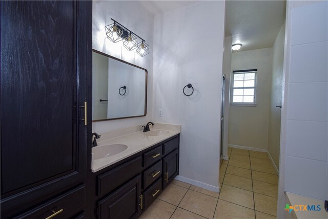 bathroom featuring vanity and tile patterned flooring