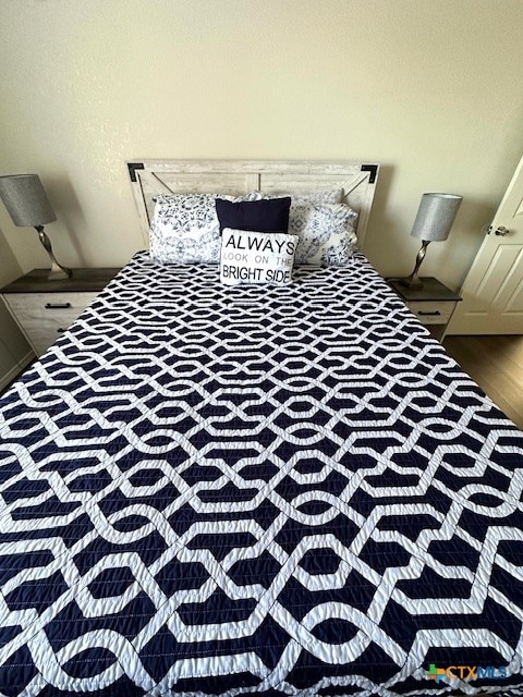 bedroom featuring dark hardwood / wood-style flooring