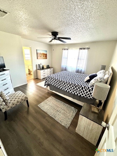 bedroom with connected bathroom, wood-type flooring, ceiling fan, and a textured ceiling