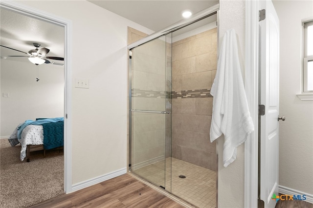 5002 Rose Garden Loop, Killeen, TX 76542 - full bath featuring ceiling fan, a tile shower, wood finished floors, baseboards, and connected bathroom