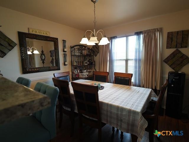 309 Bashaw Loop, Temple, TX 76502 - dining room with a chandelier and wood finished floors