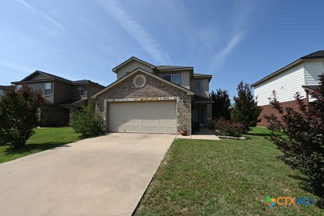 309 Bashaw Loop, Temple, TX 76502 - traditional home with an attached garage, driveway, and a front yard