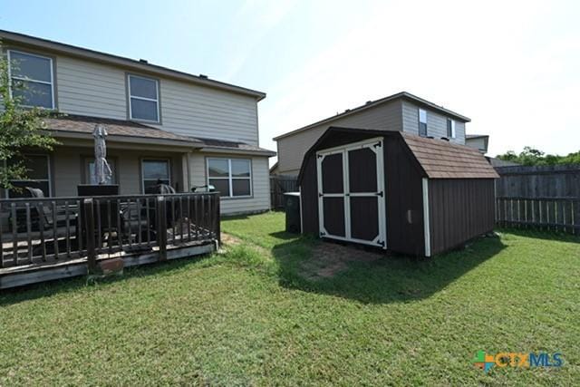 309 Bashaw Loop, Temple, TX 76502 - fenced backyard with a shed and a wooden deck