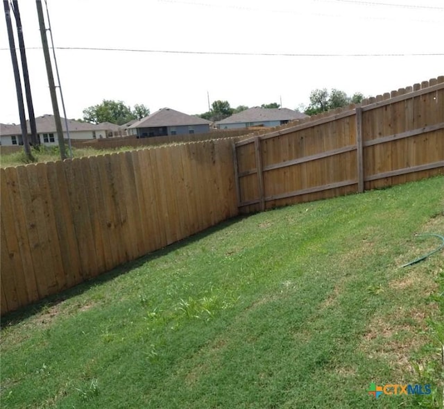 view of yard featuring a fenced backyard