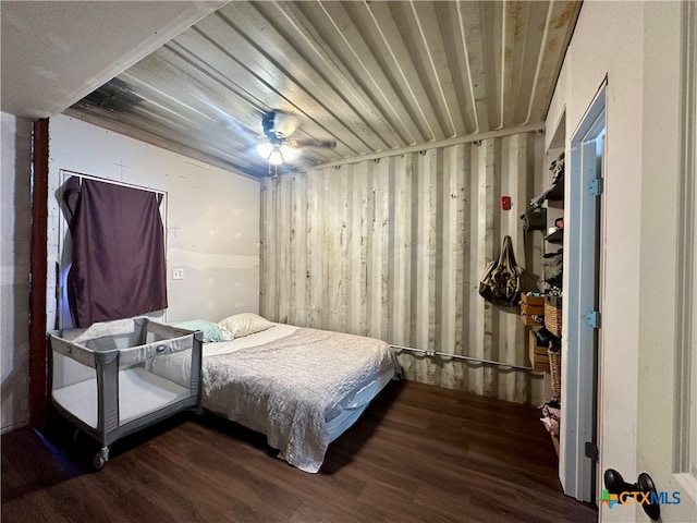 bedroom with hardwood / wood-style floors and ceiling fan