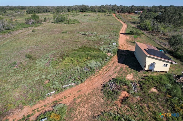 birds eye view of property featuring a rural view